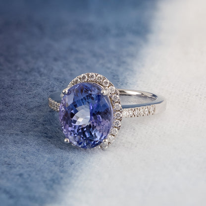 Oval Tanzanite & 1/3 ct. tw. Diamond Halo Ring in 14K White Gold close-up detail