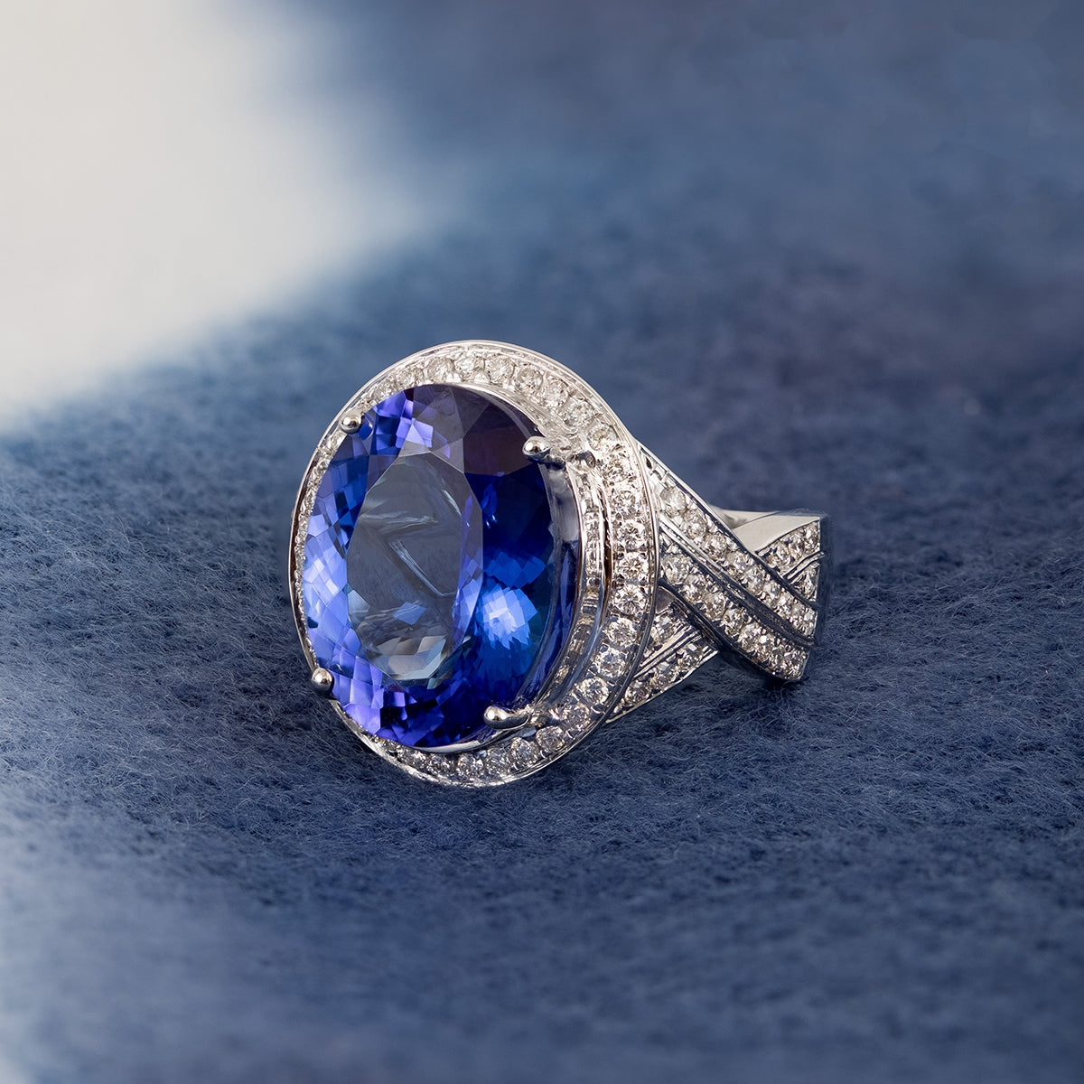 Oval Tanzanite & 1 ct. tw. Diamond Halo Twist Ring in 14K White Gold close-up detail
