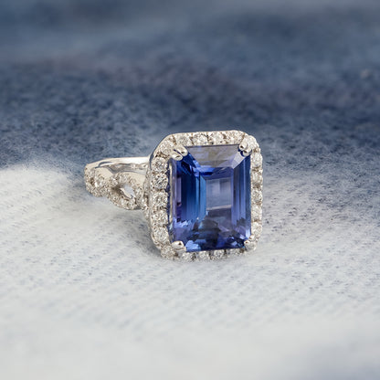 Emerald Cut Tanzanite & 1-1/10 ct. tw. Diamond Halo Twist Ring in 14K White Gold close-up detail