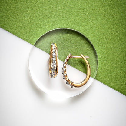 Journey Collection 1/4 ct. tw. Diamond Oval Hoop Earrings in 10K Yellow Gold front view