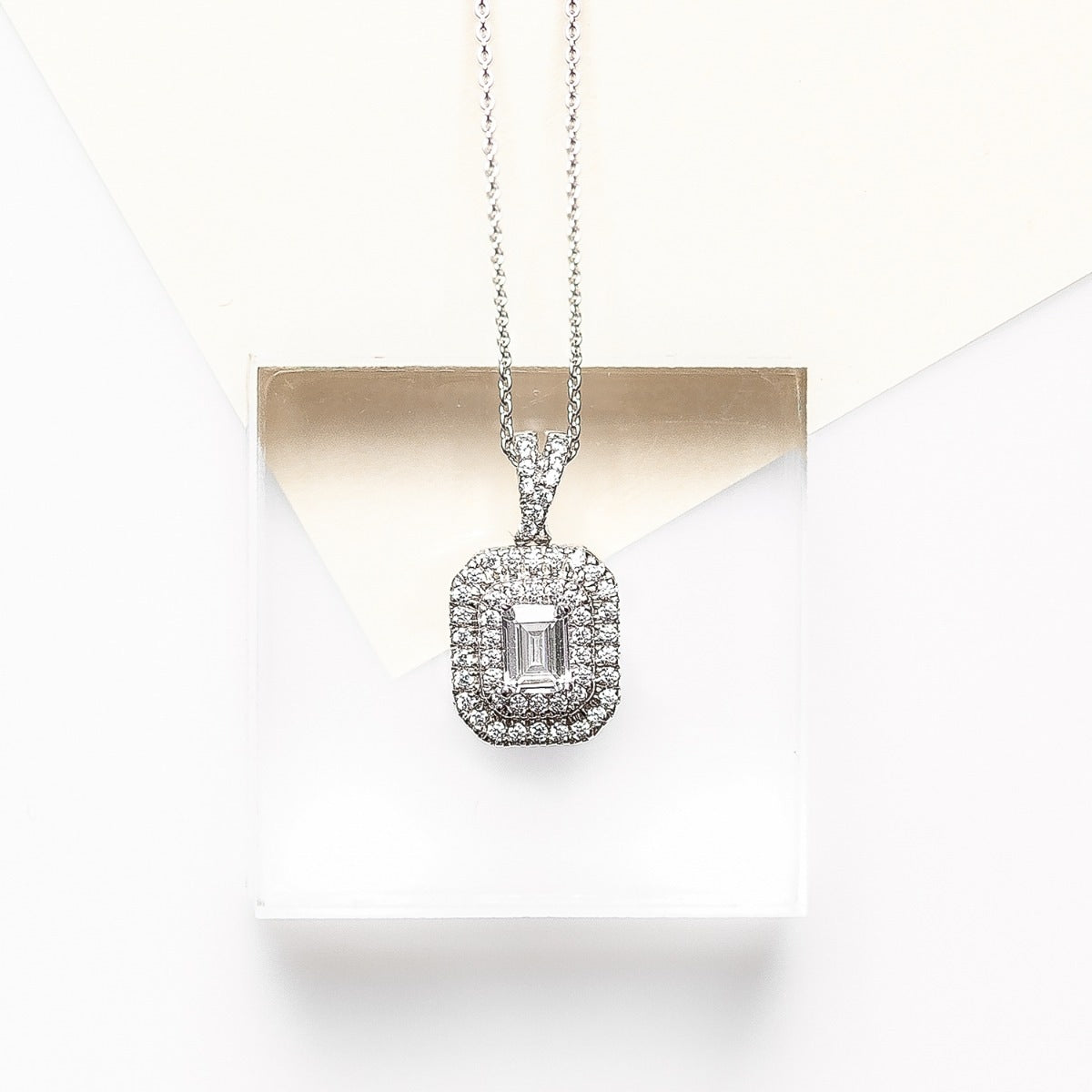 1/3 ct. tw. Emerald Cut Diamond Double Halo Pendant in 10K White Gold front view