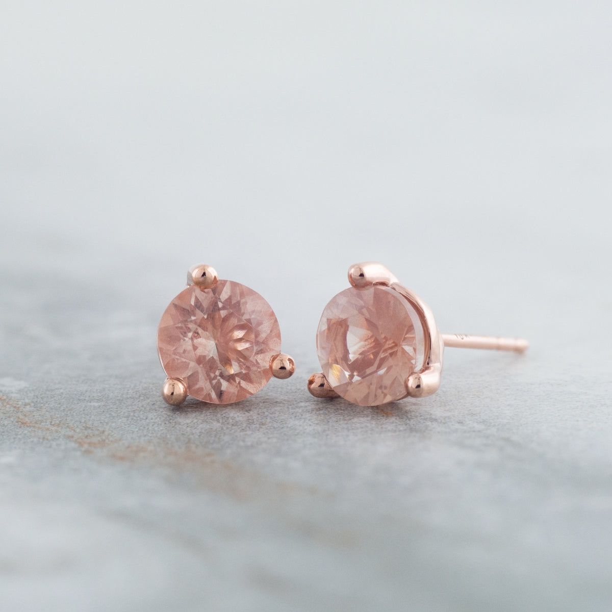 American Colors 6mm Round Sunstone Solitaire Earrings in 10K Pink Gold front view