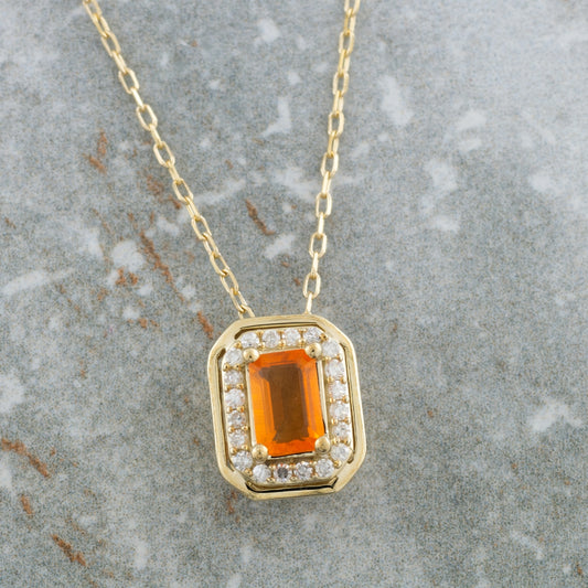 American Colors Emerald Cut Fire Opal & 1/8 ct. tw. Diamond Halo Pendant in 10K Yellow Gold front view