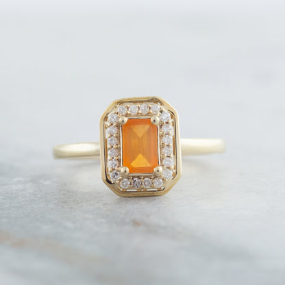 American Colors Emerald Cut Fire Opal & 1/8 ct. tw. Diamond Halo Ring in 10K Yellow Gold close-up detail