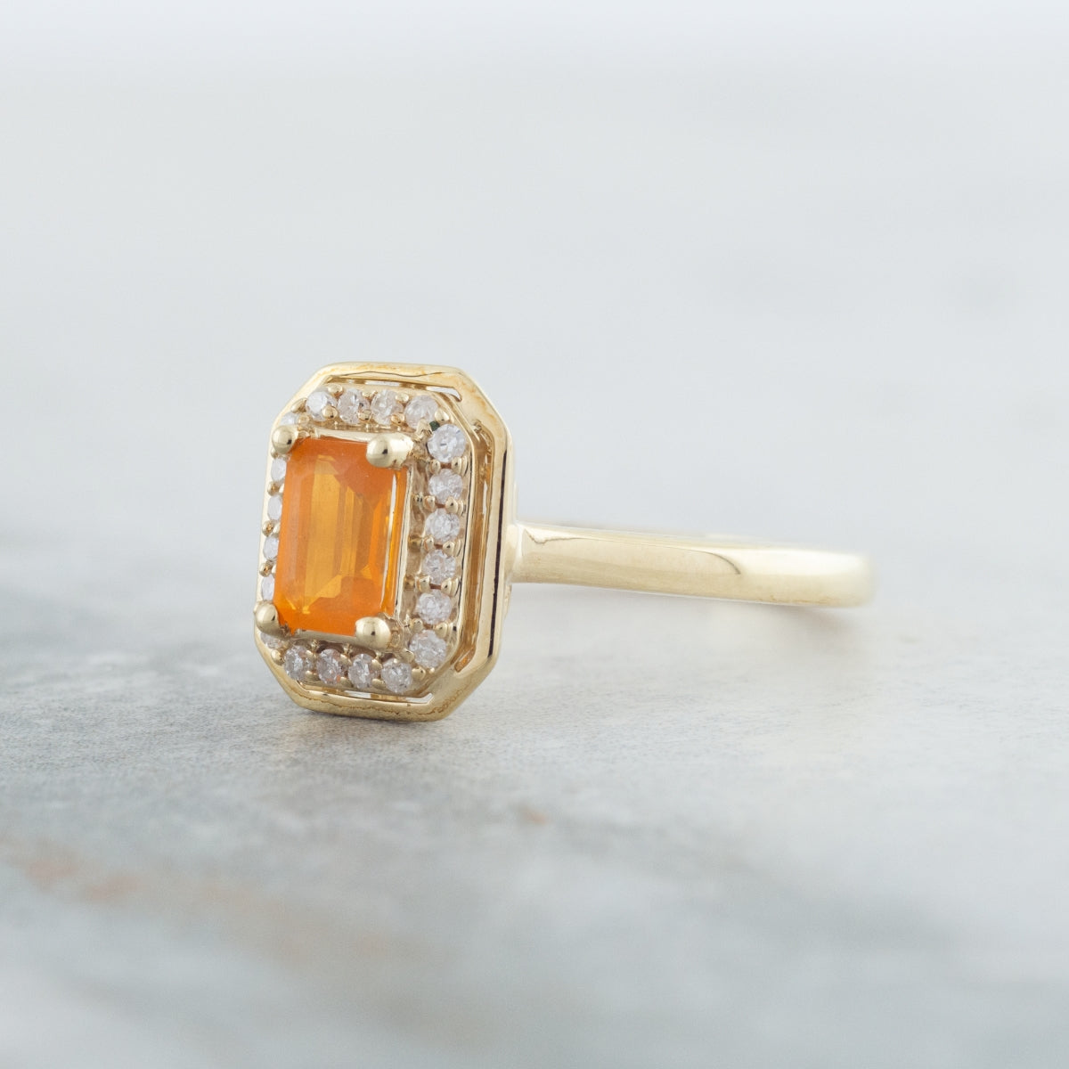 American Colors Emerald Cut Fire Opal & 1/8 ct. tw. Diamond Halo Ring in 10K Yellow Gold side profile