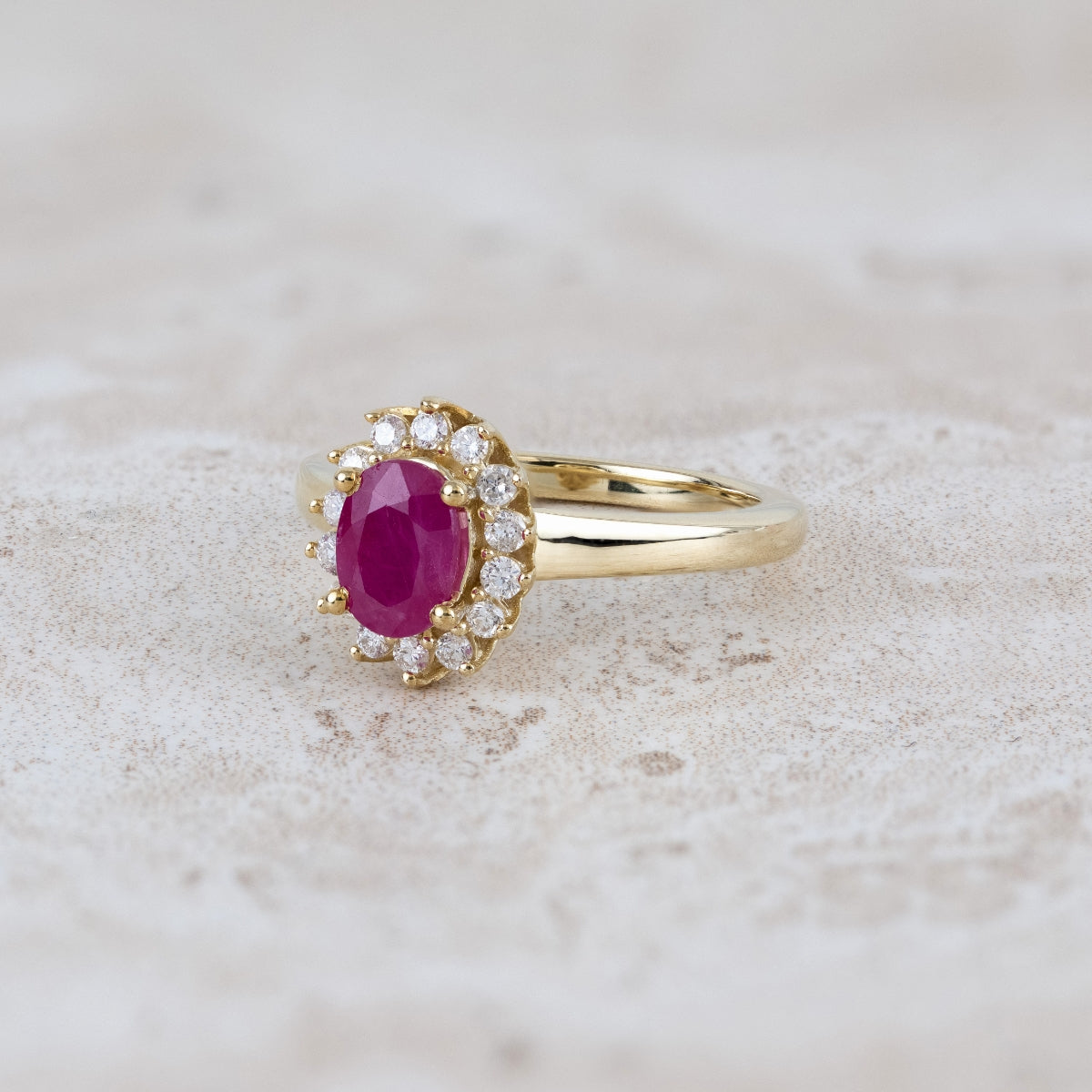 Oval Ruby & 1/4 ct. tw. Diamond Halo Ring in 10K Yellow Gold close-up detail