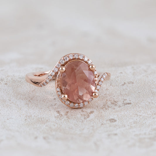 American Colors Oval Sunstone & 1/6 ct. tw. Diamond Halo Bypass Ring in 10K Pink Gold close-up detail