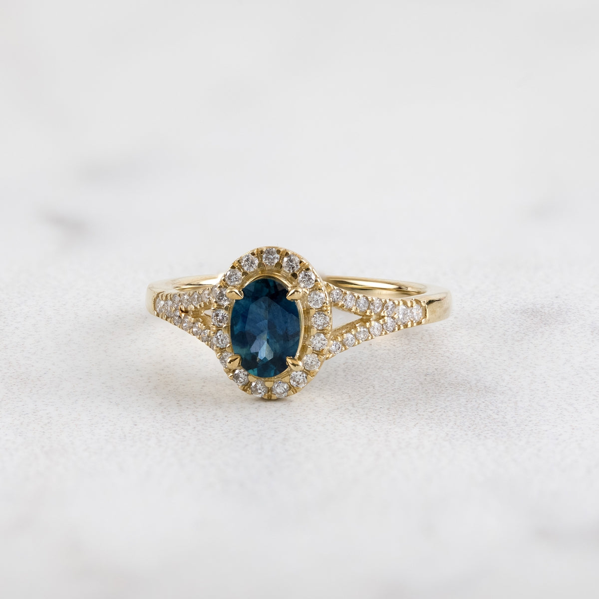 American Colors Oval Montana Sapphire & 1/4 ct. tw. Diamond Halo Split Shank Ring in 10K Yellow Gold close-up detail