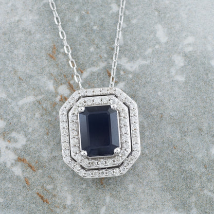 Emerald Cut Sapphire & 1/3 ct. tw. Diamond Double Halo Pendant in 10K White Gold front view