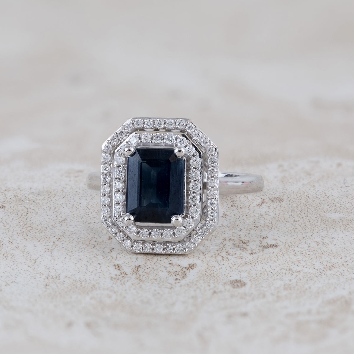 Emerald Cut Sapphire & 1/3 ct. tw. Diamond Double Halo Ring in 10K White Gold close-up detail