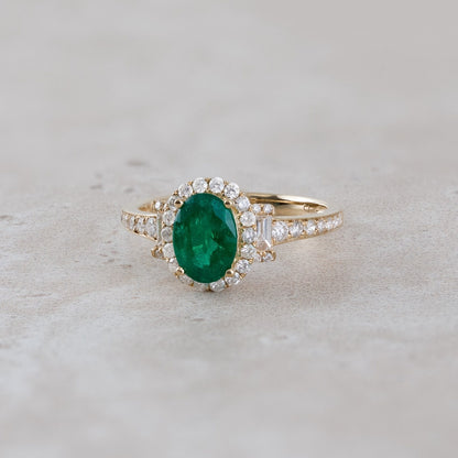Oval Emerald & 1/2 ct. tw. Round & Baguette Diamond Halo Ring in 18K Yellow Gold close-up detail
