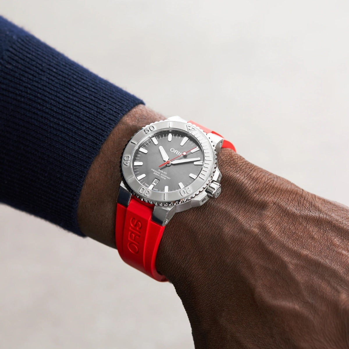 Oris Men's Aquis Date Relief Automatic Stainless Steel Watch with Gray Dial & Red Rubber Strap front view
