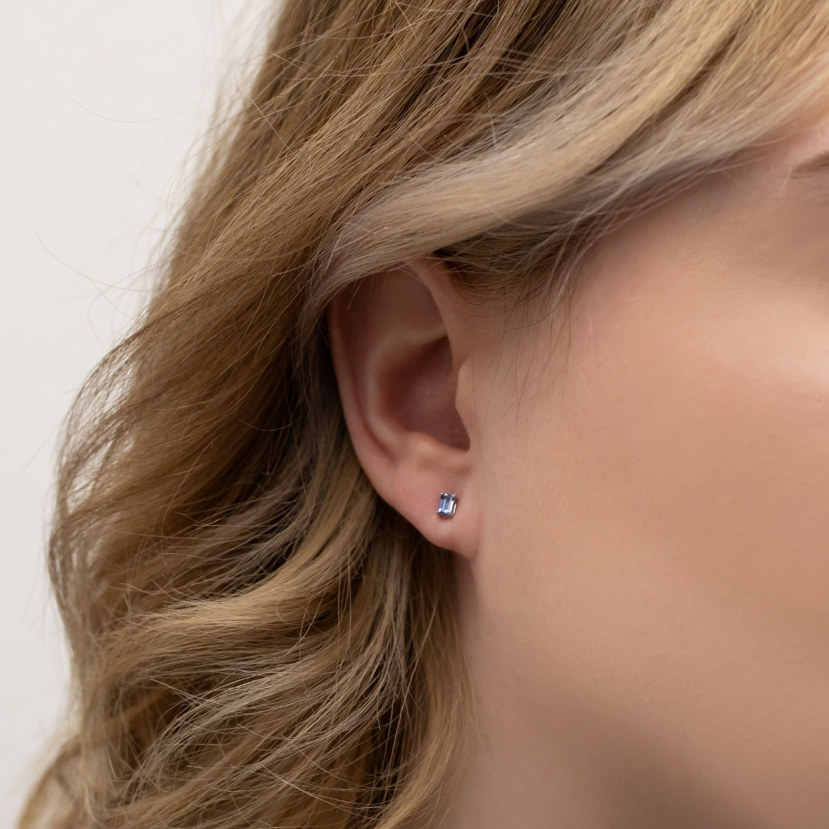 Emerald Cut Yogo Sapphire Earrings in 10K White Gold front view
