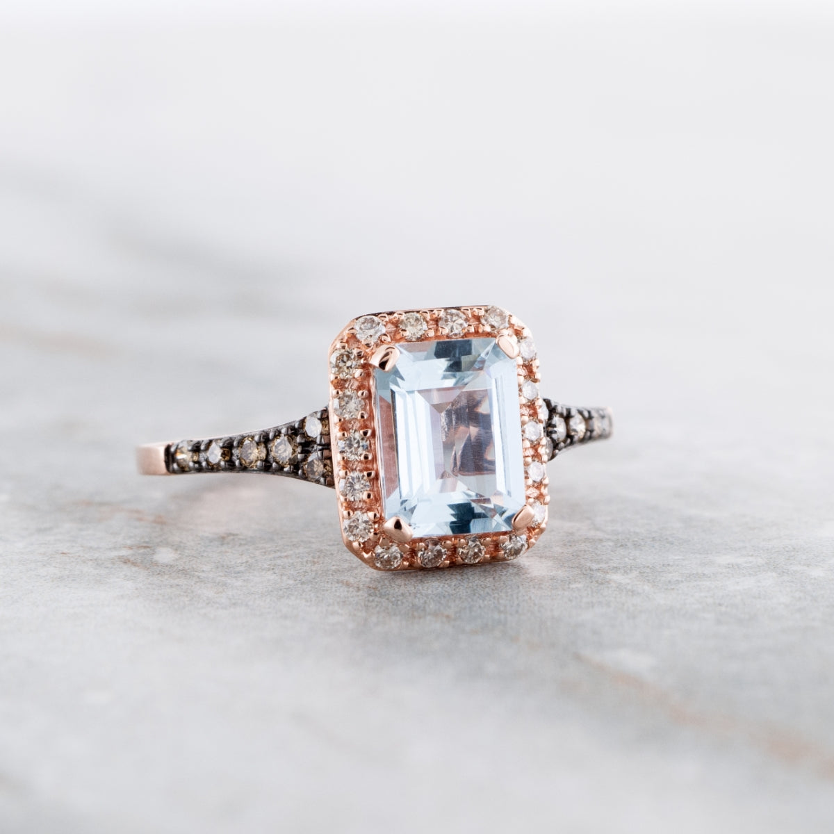 Le Vian Emerald Cut Sea Blue Aquamarine & 1/4 ct. tw. Chocolate Diamond Halo Ring in 14K Strawberry Gold close-up detail