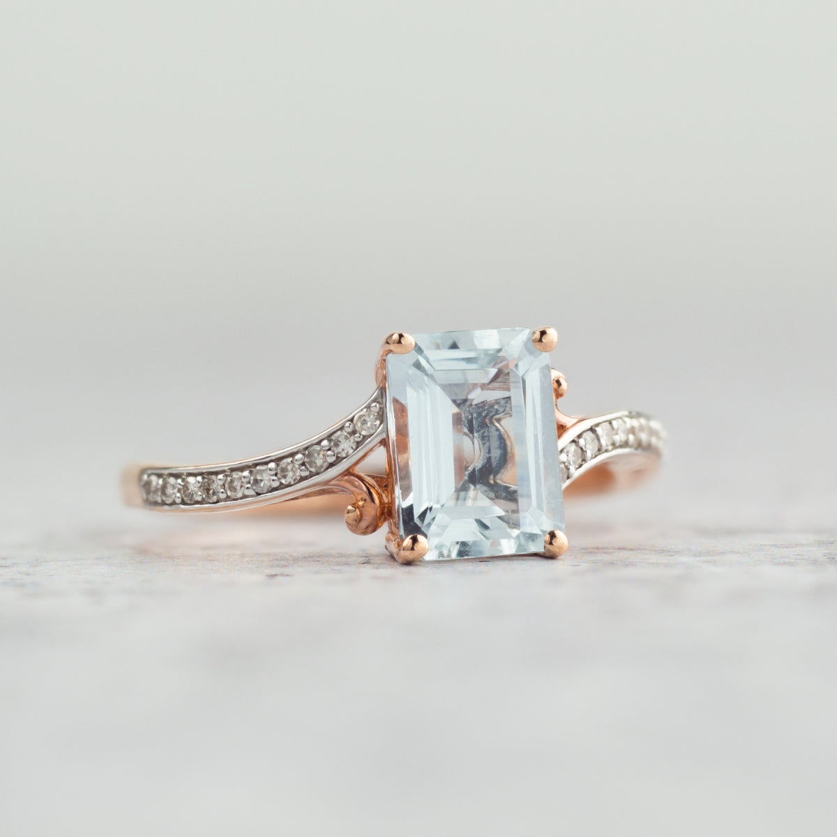 Emerald Cut Aquamarine & Diamond Accent Bypass Ring in 10K Pink Gold side profile