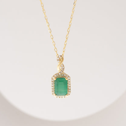 Infinite Love Emerald Cut Emerald & 1/10 ct. tw. Diamond Pendant in 10K Yellow Gold front view