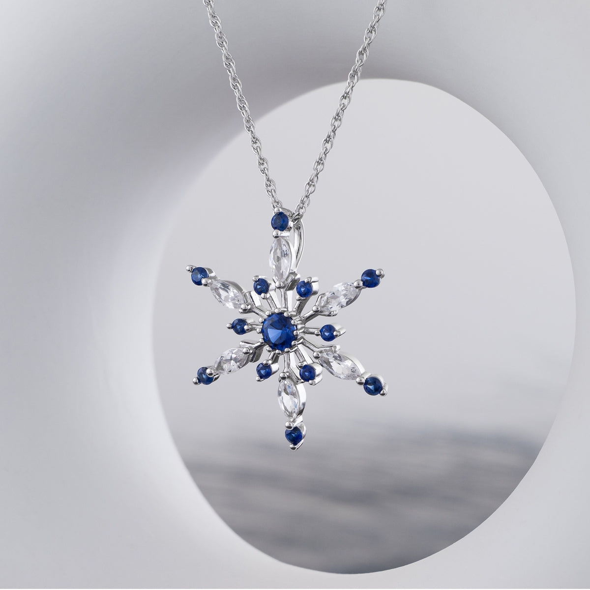 Created Blue & White Sapphire Snowflake Pendant in Sterling Silver front view