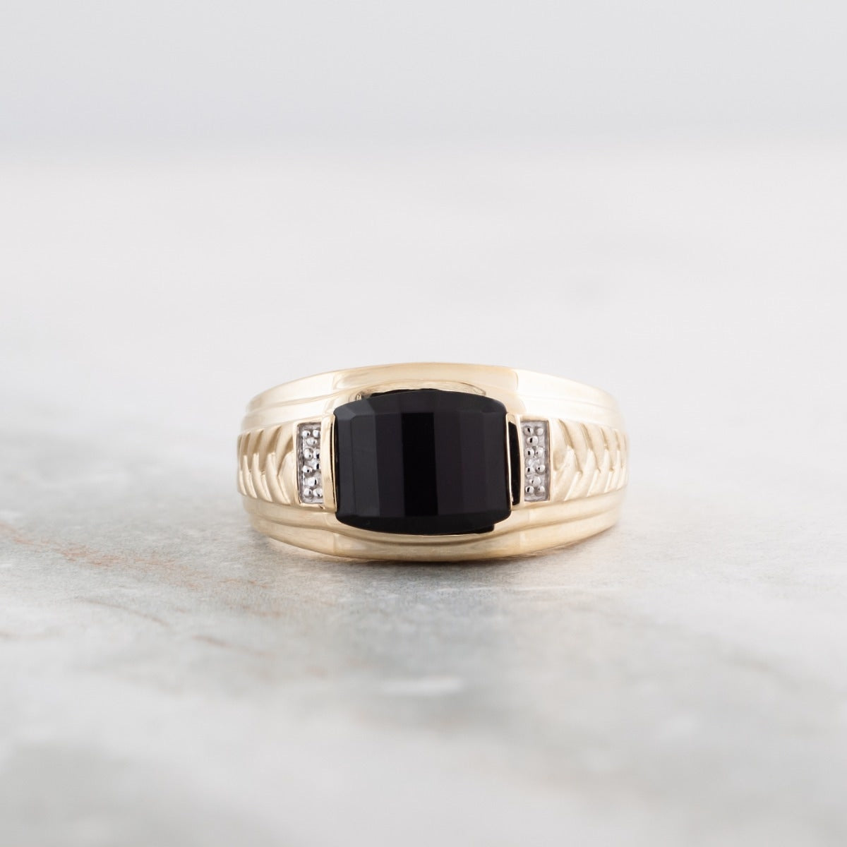 Men's Created Barrel Cut Onyx & Diamond Accent Braided Ring in 10K Yellow Gold close-up detail