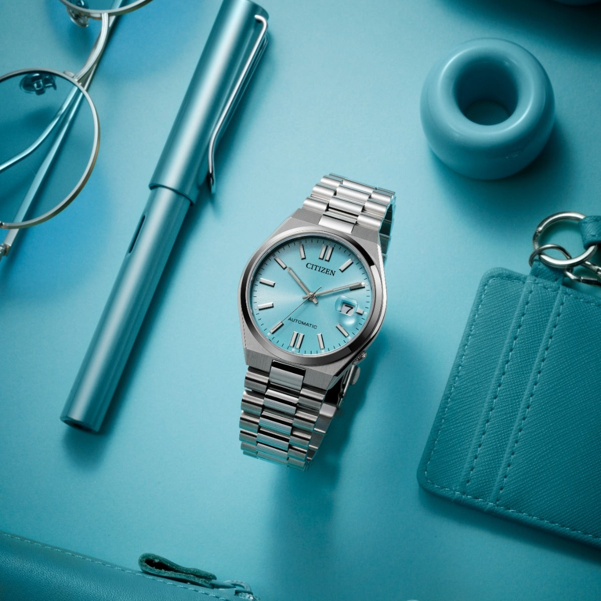Citizen Men's TSUYOSA Automatic Stainless Steel Watch with Sky Blue Dial side profile
