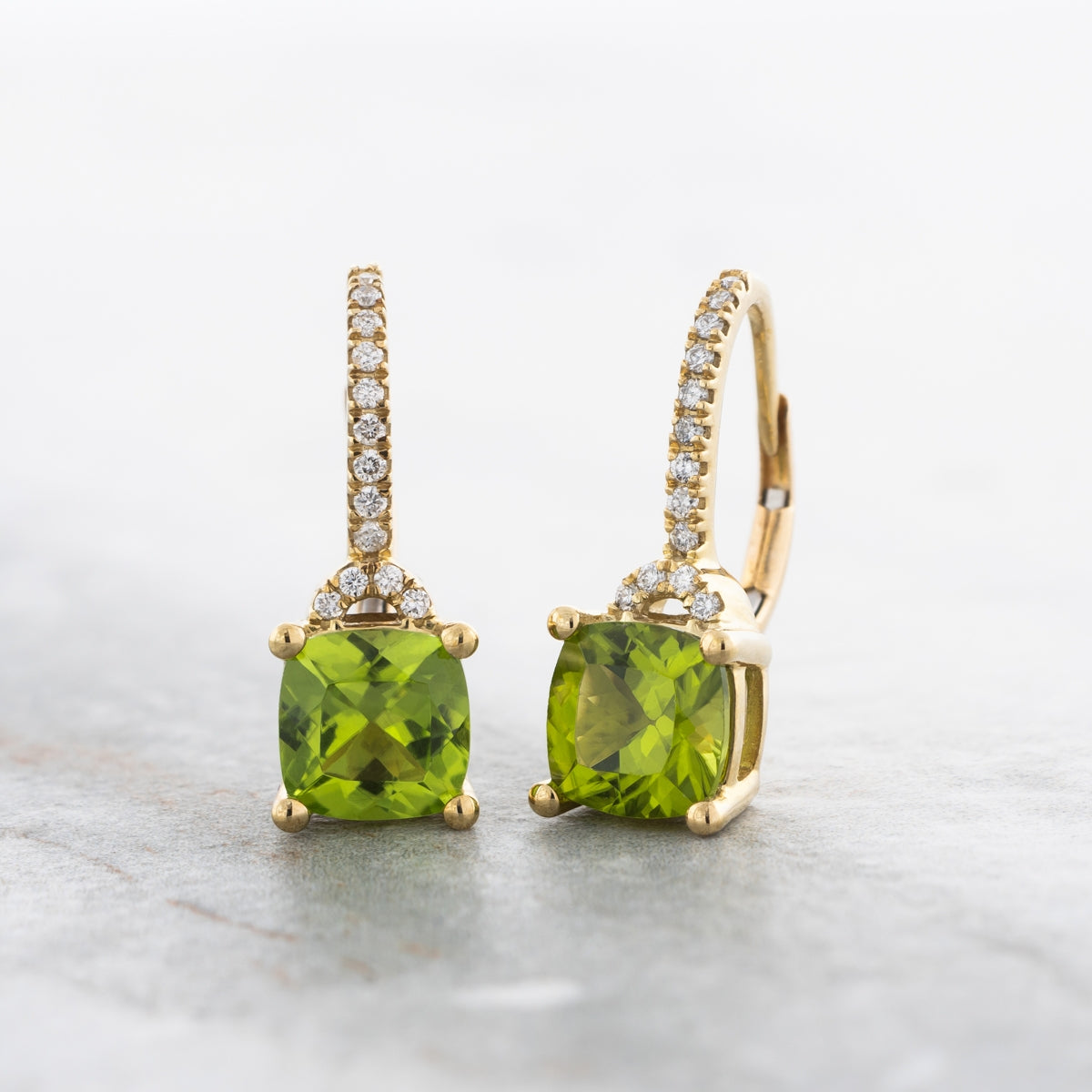 American Colors Cushion Peridot & 1/6 ct. tw. Diamond Dangle Earrings in 10K Yellow Gold front view