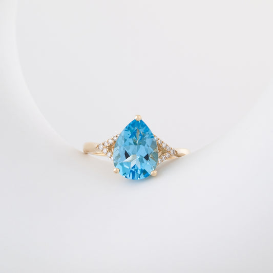 Pear Swiss Blue Topaz & Diamond Accent Ring in 10K Yellow Gold close-up detail