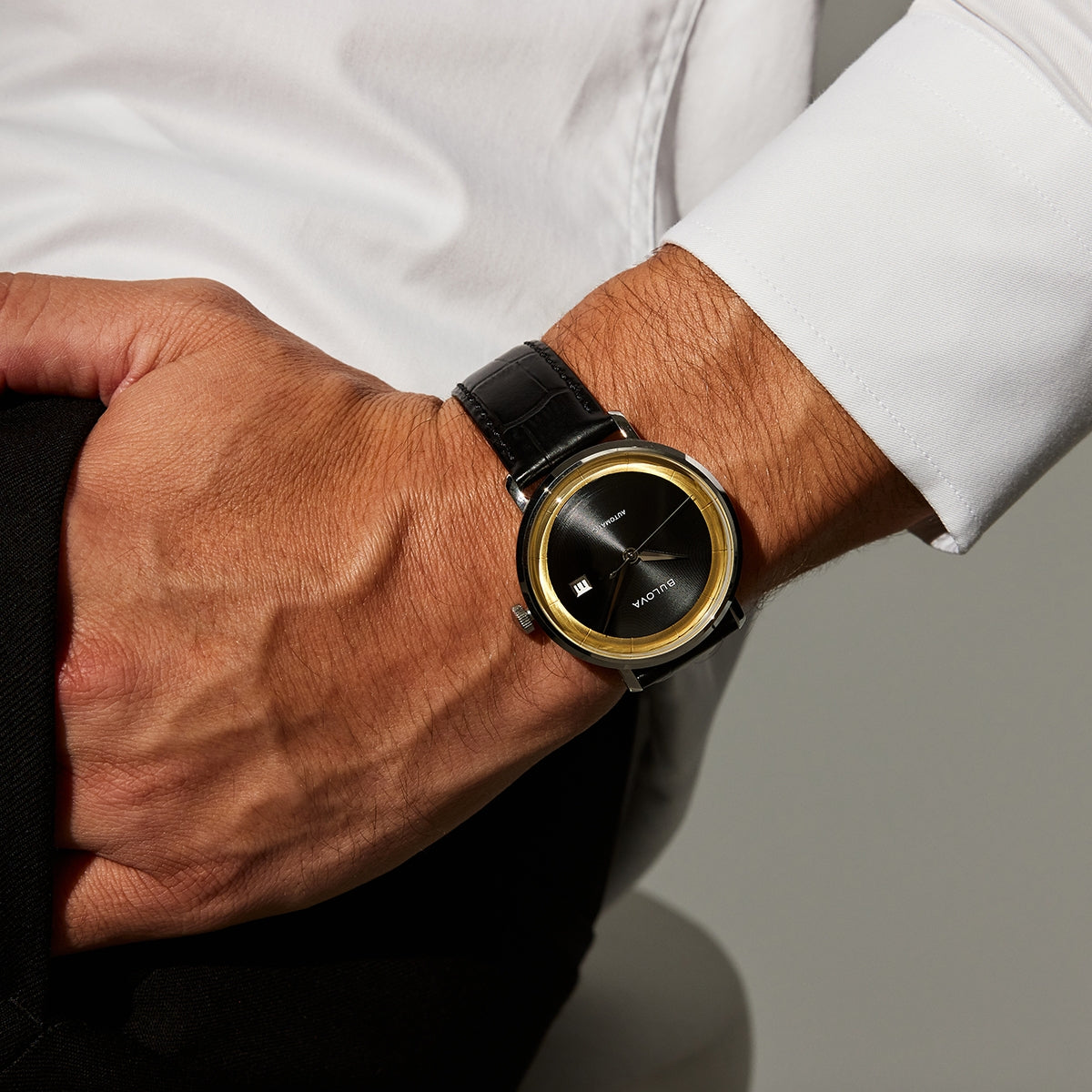 Bulova Men's Frank Sinatra Rat Pack Automatic Stainless Steel Watch with Black & Gold Dial & Leather Strap side profile