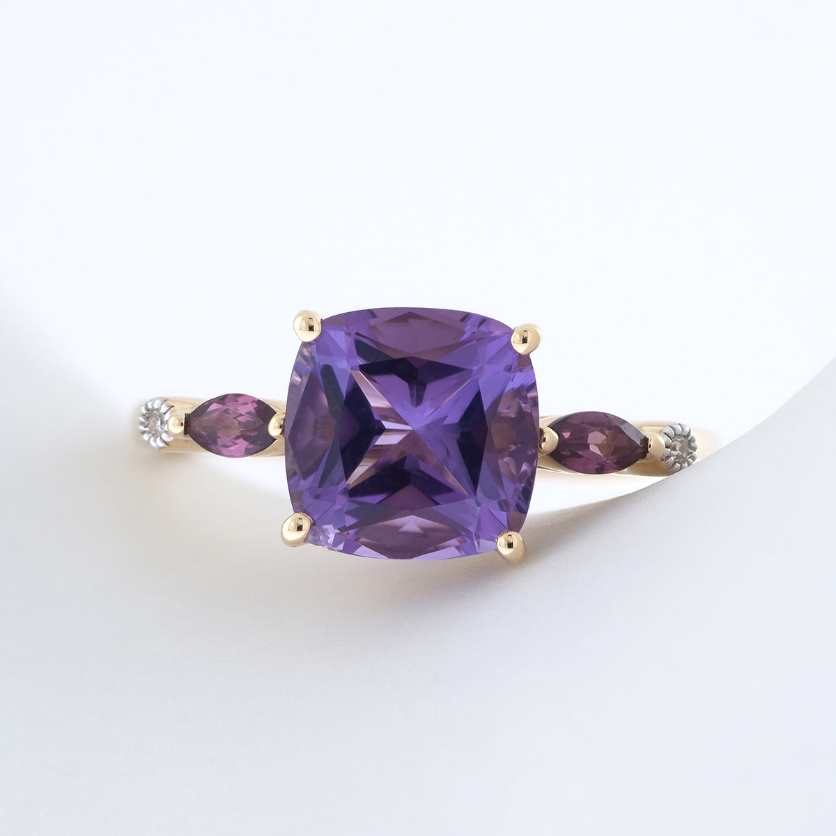 Cushion Amethyst, Marquise Rhodolite Garnet, & Diamond Accent Ring in 10K Yellow Gold close-up detail