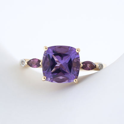 Cushion Amethyst, Marquise Rhodolite Garnet, & Diamond Accent Ring in 10K Yellow Gold close-up detail