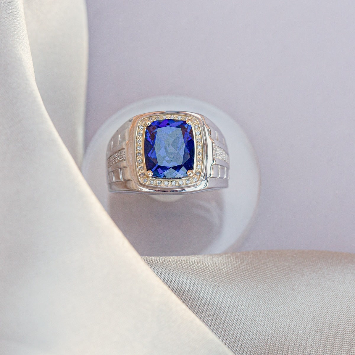 Men's Created Cushion Sapphire & 1/7 ct. tw. Diamond Halo Ring in Sterling Silver & 10K Yellow Gold close-up detail