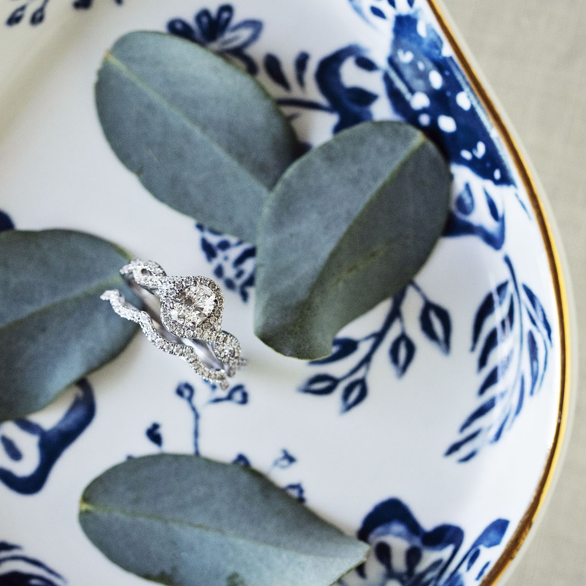 Natural 1 ct. tw. Oval Diamond Halo Twist Wedding Set in 14K White Gold full view