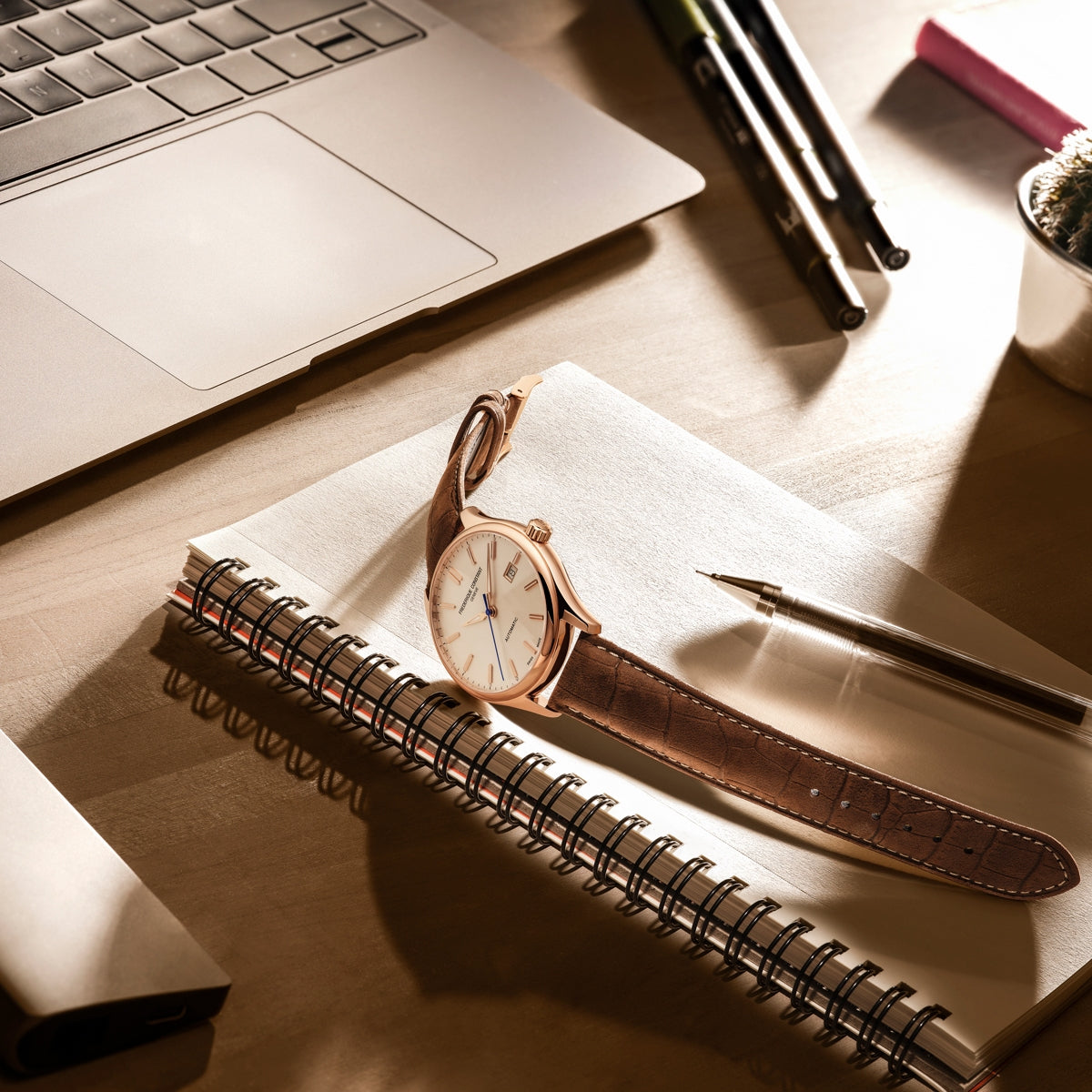 Frederique Constant Men's Index Automatic Rose Gold-Tone Stainless Steel Watch with Silver Dial & Brown close-up detail