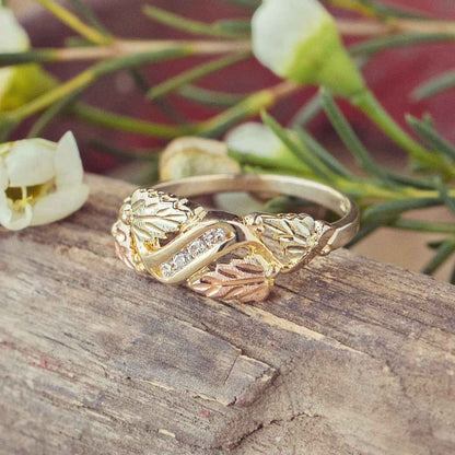 Black Hills Gold 1/8 ct. tw. Round Diamond Channel Set Grapevine & Leaf Anniversary Ring in 10K Yellow Gold close-up detail