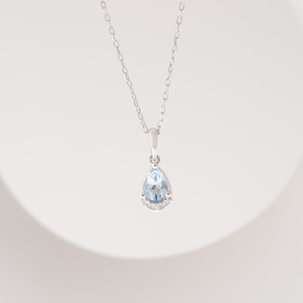 Pear Aquamarine & Diamond Accent Pendant in 10K White Gold front view