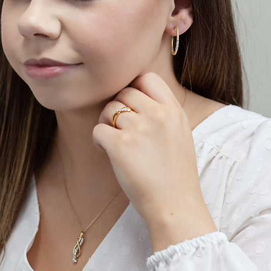 Journey Collection 1/2 ct. tw. Diamond Knot Pendant in 10K Yellow Gold close-up detail