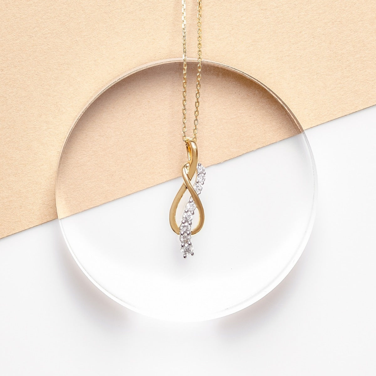 Journey Collection 1/2 ct. tw. Diamond Knot Pendant in 10K Yellow Gold front view