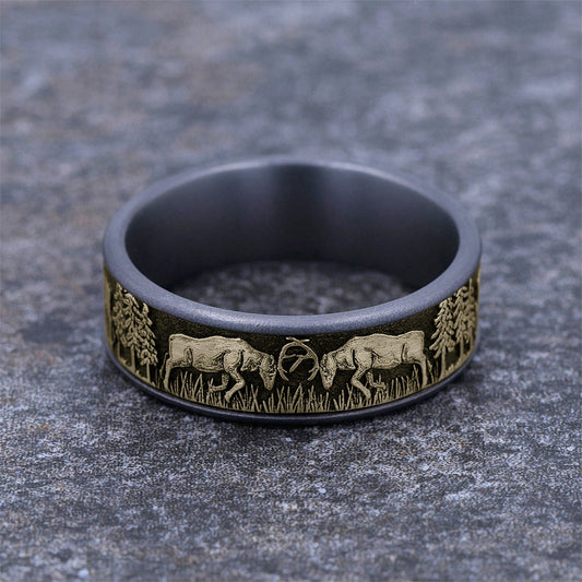 Men's 7.5mm Deer Fight Wedding Ring in Gray Tantalum & 14K Yellow Gold close-up detail