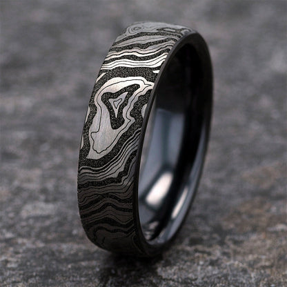 Men's 6.5mm Topographical Denali Wedding Ring in Black & White Titanium close-up detail