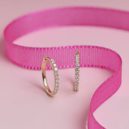 1/3 ct. tw. Diamond Oval Hoop Earrings in 14K Yellow Gold close-up detail