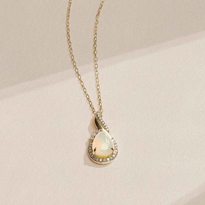 Infinite Love Pear Opal & 1/10 ct. tw. Diamond Partial Halo Pendant in 10K Yellow Gold front view