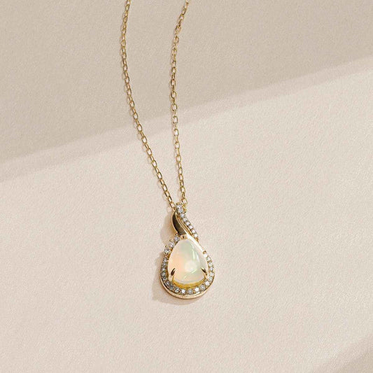 Infinite Love Pear Opal & 1/10 ct. tw. Diamond Partial Halo Pendant in 10K Yellow Gold front view