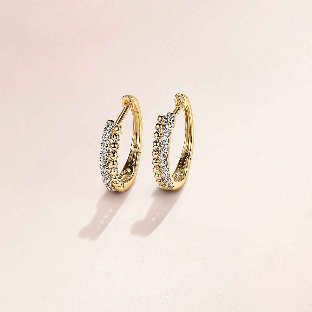 Gabriel & Co. 1/10 ct. tw. Diamond Bujukan Huggie Hoop Earrings in 14K Yellow Gold front view