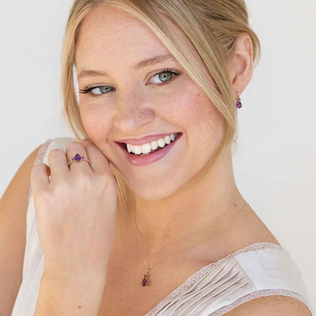 Pear & Round Amethyst & Diamond Accent Ring in 10K Yellow Gold close-up detail