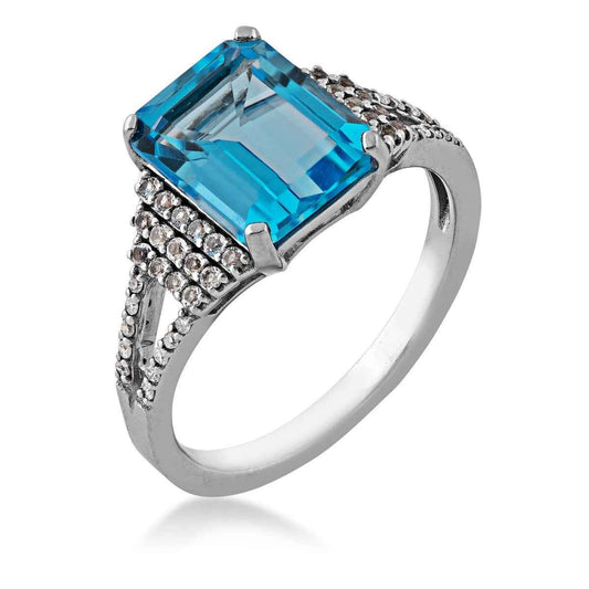 Emerald Cut Swiss Blue Topaz Ring with White Topaz Accented Band in Sterling Silver front view