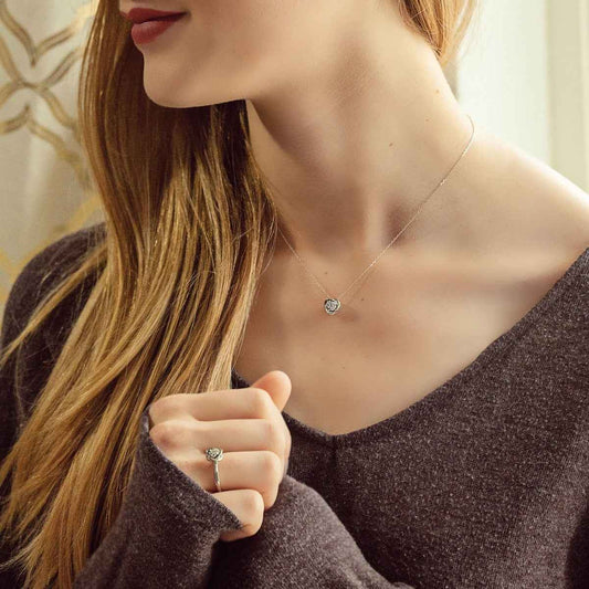 Love Knot 1/10 ct. tw. Diamond Cluster Pendant in 10K White Gold close-up detail