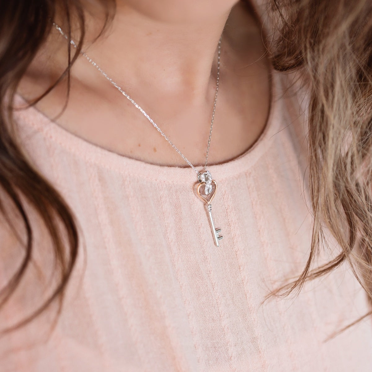 Infinite Love 1/6 ct. tw. Diamond Heart Key Pendant in Sterling Silver and 10K Pink Gold front view