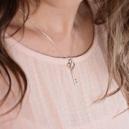 Infinite Love 1/6 ct. tw. Diamond Heart Key Pendant in Sterling Silver and 10K Pink Gold front view