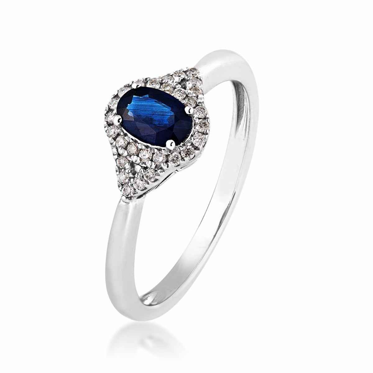 Genuine Oval Sapphire & 1/10 ct. tw. Diamond Halo Ring in 10K White Gold