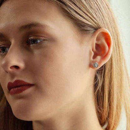 Love Knot 1/6 ct. tw. Diamond Cluster Earrings in 10K White Gold close-up detail