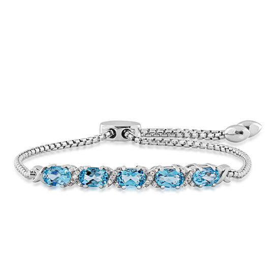 Genuine Oval Blue Topaz & Created White Sapphire Accented Bolo Bracelet in sterling Silver