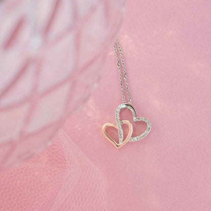 1/10 ct. tw. Diamond Heart Pendant with Rose Plated Heart Accent in Sterling Silver front view